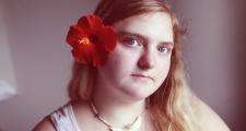 Autistic girl with flower in hair