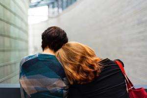 A child and parent wait for support